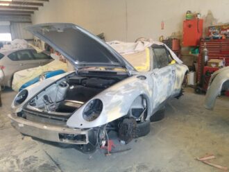 Porsche auto body being repaired
